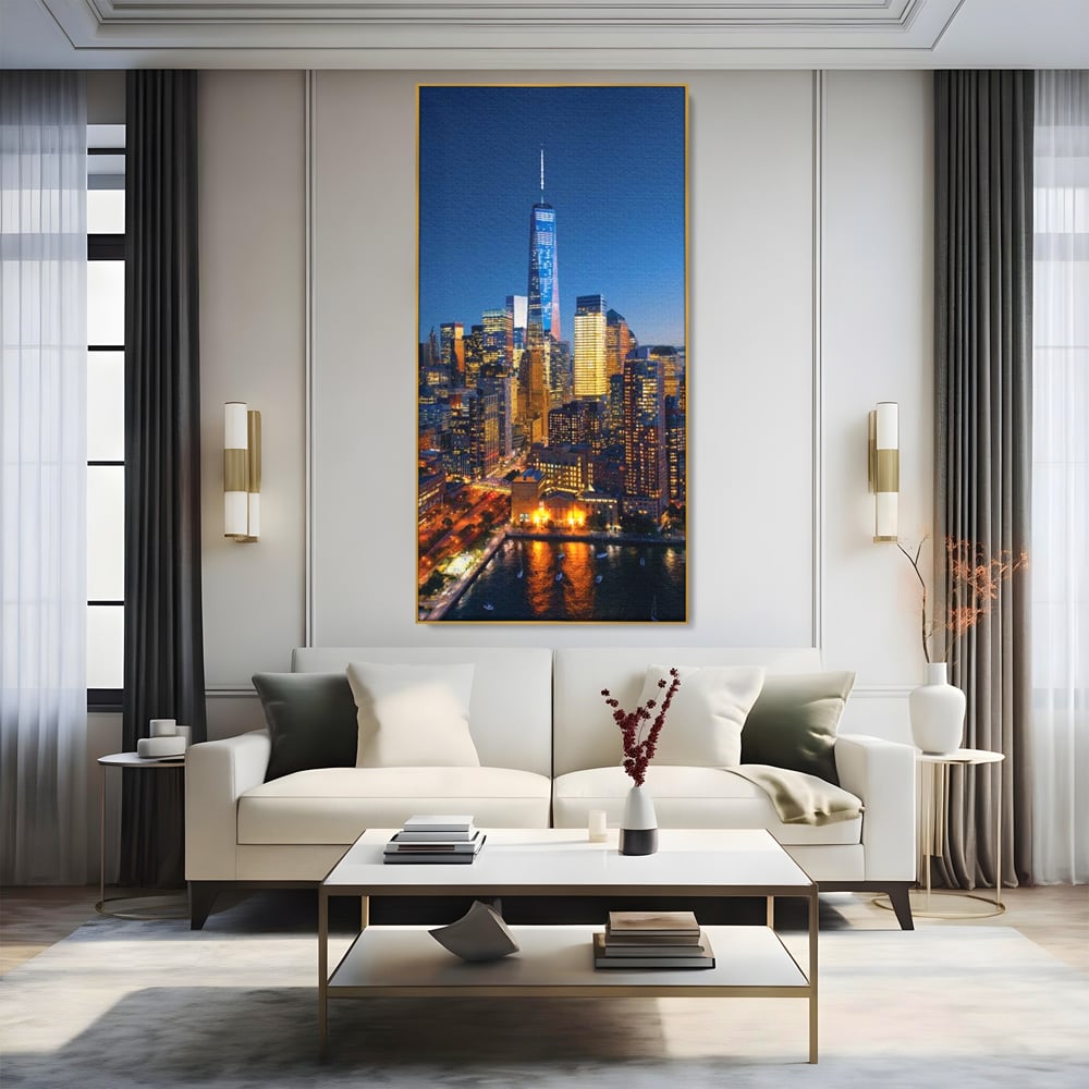 Tablou canvas cu panoramic nocturn cu zghiet-nori din new york, in rama de aluminiu auriu, pe perete intr-un living